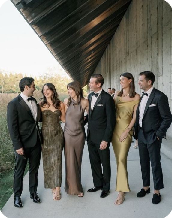 three gowns in bronze, smoke and gold with black tie