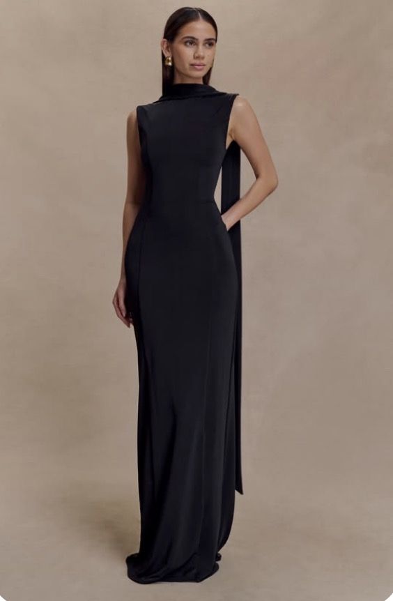 a black column gown with a draped scarf